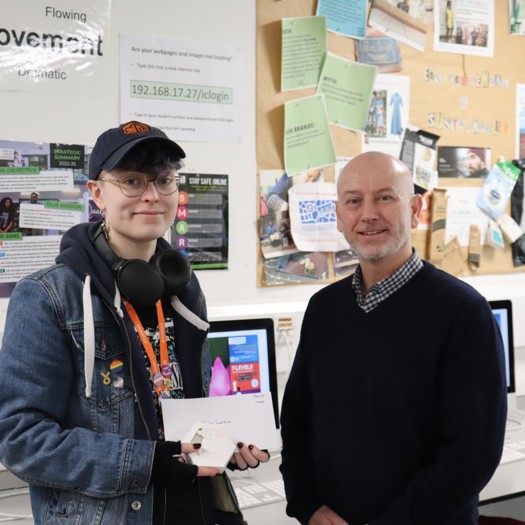 Larkin (left) receiving the gold award from Mallett