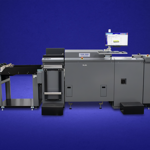 The DSM-1000 is Duplo's first flatbed die cutter