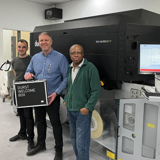 Digital print manager Paul Street (centre), with digital print operators Robertas Vaitkevicius (L) and Julius Mhuka (R)